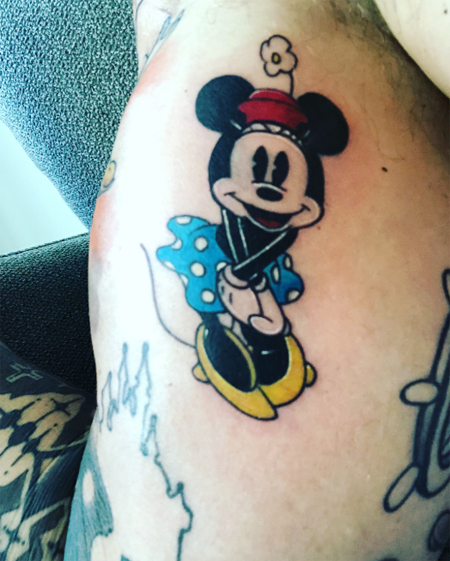 Minnie Mouse on the inner bicep of David's arm.